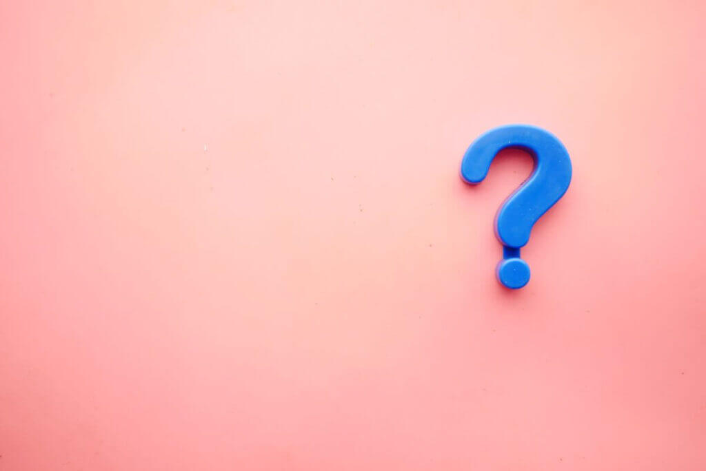 blue question mark on light pink background